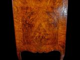 an image of a very old wooden chest of drawers on a black background
