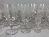 a lot of wine glasses sitting on a table
