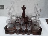 a tray with glasses and a candle holder on it