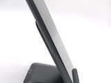 a cell phone that is sitting on top of a stand
