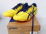 asics gelb yellow and blue running shoes on a box