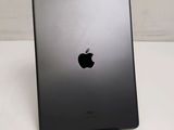 an apple ipad is sitting on a table with a white background
