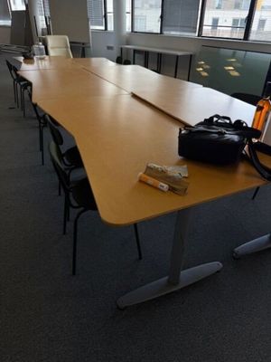 a long table with a bag on it in a room