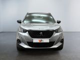 the front view of a silver car in a white room