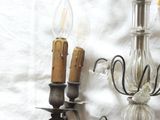 two lights that are on the wall next to each other