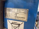 an image of a blue machine with a label on it