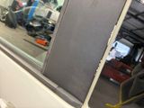 a reflection of a motorcycle in the window of a vehicle