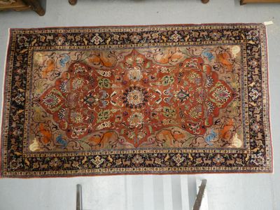 a rug hanging on a wall in a room
