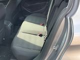 the back of a car with the door open and the seats down