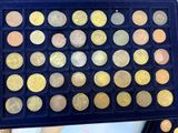 a picture of a tray with a lot of coins in it