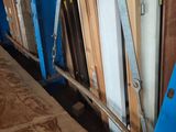 several pieces of wood are stacked on top of each other in a room