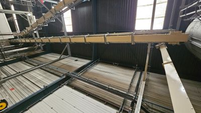 a machine that is working on the floor of a factory