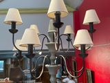 a chandelier that has a lot of lamps hanging from it