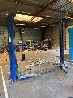 an image of a car being worked on in a garage