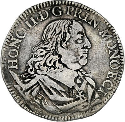 une pièce en argent avec l'image d'un homme de profil