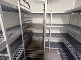 a metal shelf with lots of shelves in a room