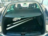 a trunk of a car that has a car lift in it