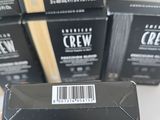 a stack of black boxes with a barcode on them