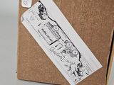 a cardboard box with a drawing of a train on it