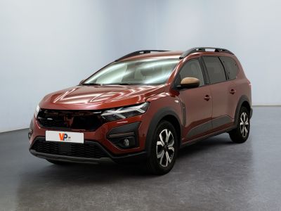a red car is parked in a room with a white wall