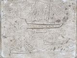 une photo d'une pierre sur laquelle est dessiné un bateau