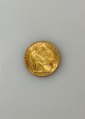 an image of a gold coin sitting on top of a white surface