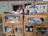many boxes stacked on top of each other in a room