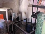 a small kitchen with a lot of dishes on the shelves