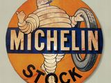 a sign that says michel stock on the side of a building