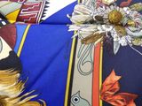 a close up of a colorful scarf with a bird on it
