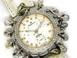 a watch that is sitting on a white leather strap
