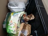 a pile of garbage in the corner of a room