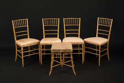 four chairs and a table are arranged in a row on a black background