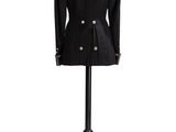 a black jacket on a mannequin stand on a white background
