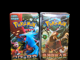 two boxes of pokemon cards on a black background