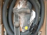 a box with a hose and a hose attached to it