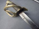 a close up of a sword on a table