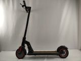 a scooter that is sitting on a white surface