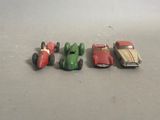 several toy cars are lined up in a row on a table