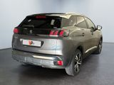the rear end of a silver suv parked in a showroom