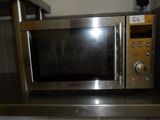 a microwave that is sitting on top of a counter