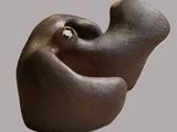a sculpture of a bird that is sitting on a table