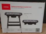 boxed picture of a bbq with a grill on top of it