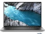 un gros plan d'un ordinateur portable posé sur une surface blanche, avec une rivière en arrière-plan