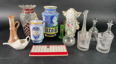 a lot of glass vases and other glass items on the table