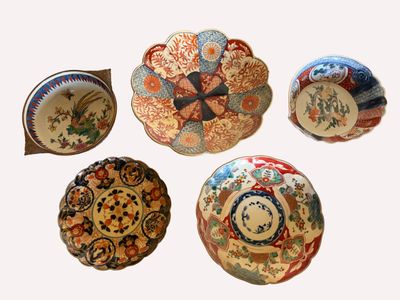 five plates with different designs on them on a white background