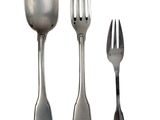 three forks and two spoons sitting next to each other