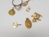 a close up of a ring with a bird and other items on it