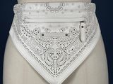 a white belt that has a white belt with a design on it