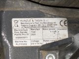 a label on the side of a machine that says kunzle & tasins